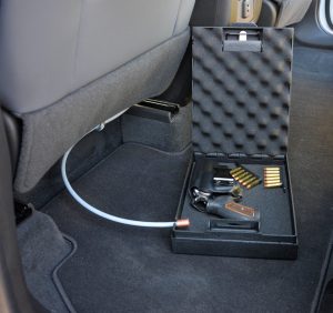 Steelhead pistol lock box on the floor in a car